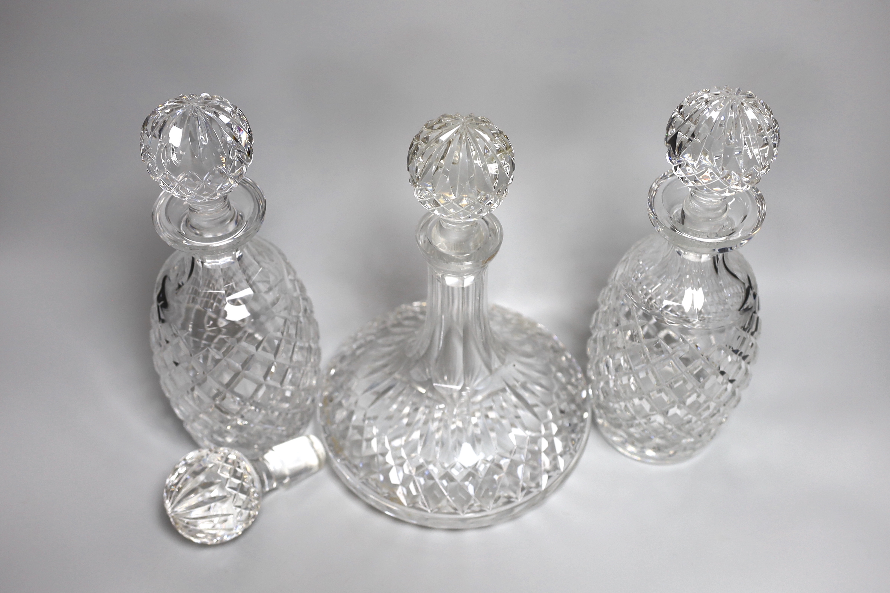 A pair of Waterford Colleen pattern decanters, a ships decanter a and four stoppers